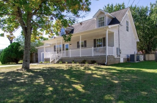 cape cod house with a porch and a front lawn