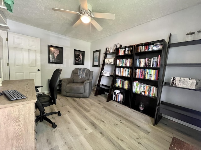 office area featuring ceiling fan, a textured ceiling, and wood finished floors