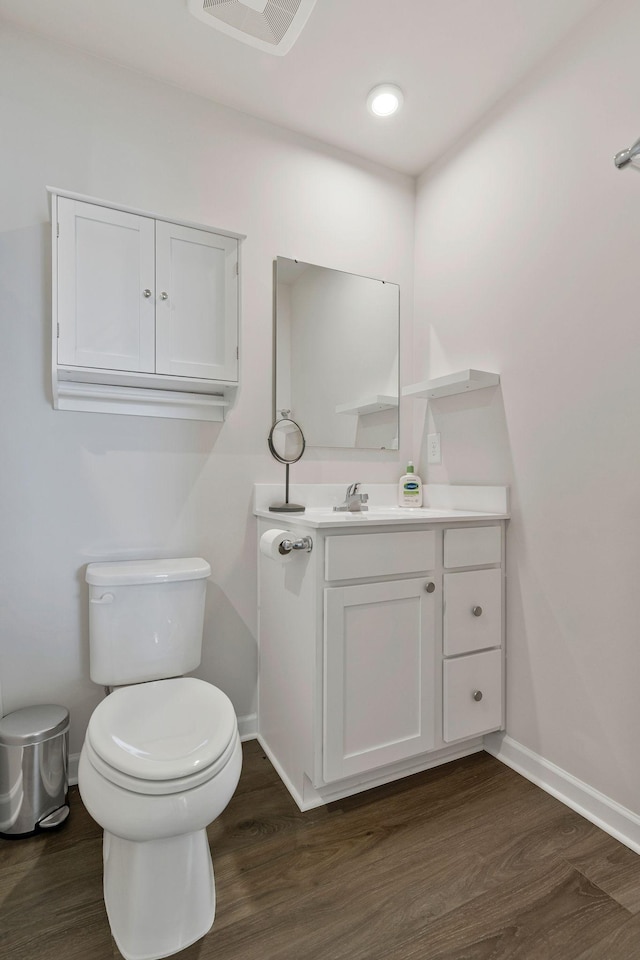 3008 Sapgate Ln, Nashville, TN 37207 - bathroom with visible vents, baseboards, toilet, wood finished floors, and vanity