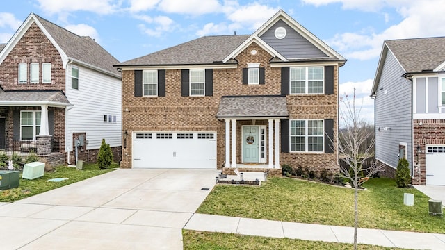 113 Joyner Ct, Gallatin, TN 37066 - view of front of house featuring driveway, brick siding, an attached garage, and a front yard