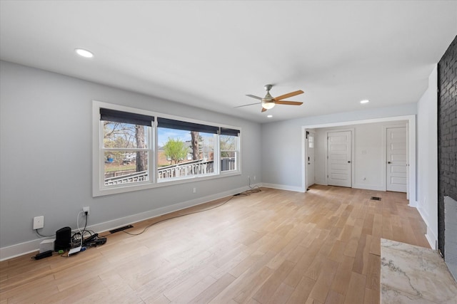 276 E Porters Bluff Rd E, Clarksville, TN 37040 - unfurnished living room featuring baseboards, light wood-style flooring, ceiling fan, and recessed lighting