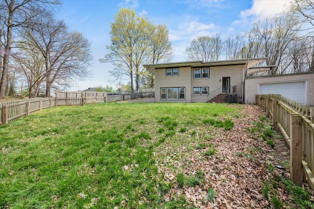 276 E Porters Bluff Rd E, Clarksville, TN 37040 - rear view of house with a lawn, a garage, central AC unit, and a fenced backyard