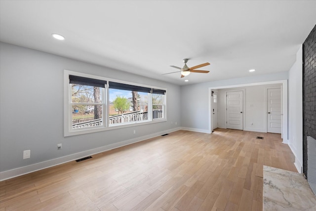 276 E Porters Bluff Rd E, Clarksville, TN 37040 - unfurnished living room featuring baseboards, visible vents, light wood-style floors, and a ceiling fan