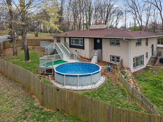 276 E Porters Bluff Rd E, Clarksville, TN 37040 - rear view of house featuring a yard, a fenced backyard, stairway, and a deck