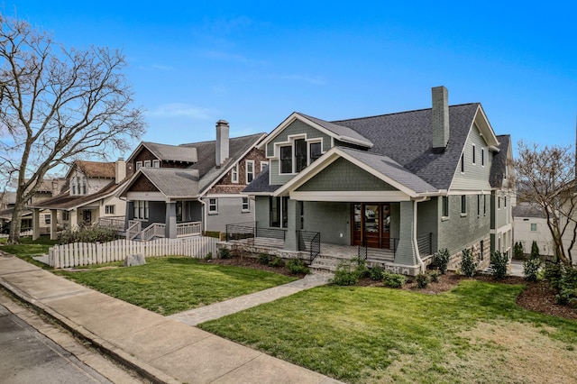1405 Ashwood Ave, Nashville, TN 37212 - view of front of property featuring a residential view, a chimney, a front yard, fence, and covered porch