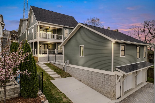 1405 Ashwood Ave, Nashville, TN 37212 - view of front facade with roof with shingles, a ceiling fan, a garage, and a balcony