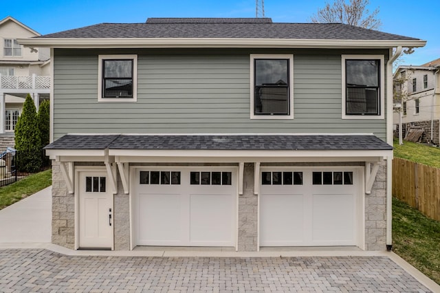 1405 Ashwood Ave, Nashville, TN 37212 - garage with decorative driveway and fence