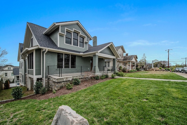 1405 Ashwood Ave, Nashville, TN 37212 - view of front of property featuring a front yard and roof with shingles