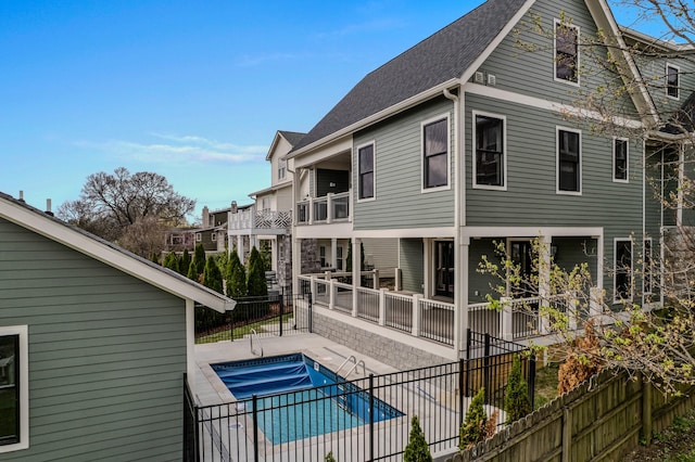 1405 Ashwood Ave, Nashville, TN 37212 - back of property featuring a fenced in pool, a patio, roof with shingles, and fence