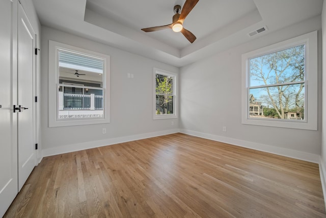 1405 Ashwood Ave, Nashville, TN 37212 - empty room featuring a raised ceiling, light wood finished floors, baseboards, and visible vents