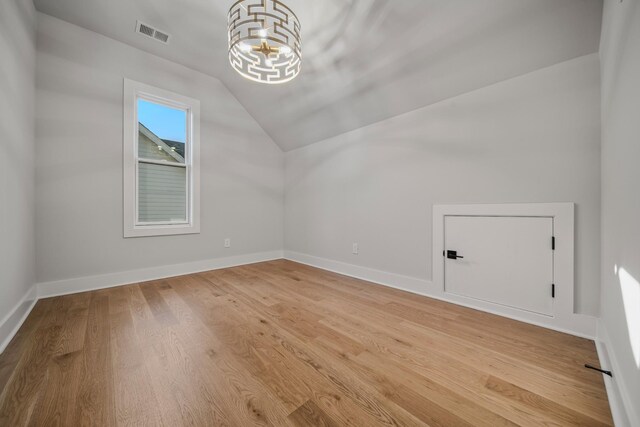 1405 Ashwood Ave, Nashville, TN 37212 - additional living space featuring visible vents, baseboards, a chandelier, light wood-style floors, and lofted ceiling