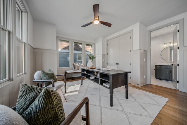 1405 Ashwood Ave, Nashville, TN 37212 - office with light wood-style flooring, a decorative wall, ceiling fan, and a wainscoted wall