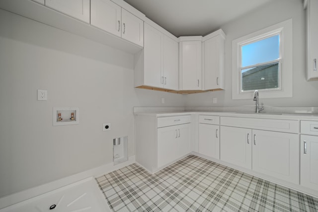 1405 Ashwood Ave, Nashville, TN 37212 - laundry room featuring hookup for an electric dryer, a sink, hookup for a washing machine, and cabinet space