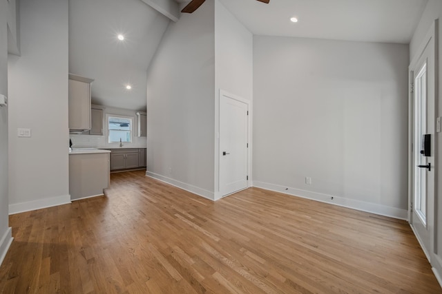1405 Ashwood Ave, Nashville, TN 37212 - unfurnished living room with light wood finished floors, a sink, a ceiling fan, and baseboards
