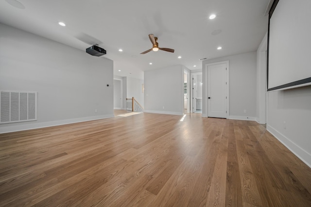 1405 Ashwood Ave, Nashville, TN 37212 - unfurnished living room featuring visible vents, baseboards, a ceiling fan, recessed lighting, and light wood-style flooring