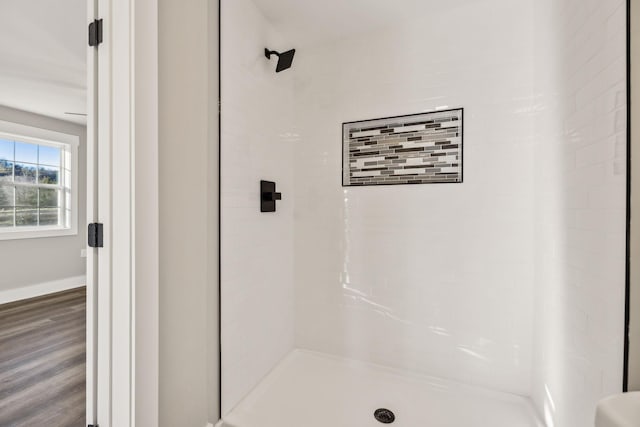 2999 Fayetteville Hwy, Belfast, TN 37019 - full bathroom featuring baseboards, wood finished floors, and a shower stall