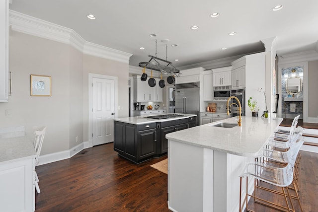 4 Colonel Winstead Dr, Brentwood, TN 37027 - kitchen with a sink, built in appliances, dark wood finished floors, ornamental molding, and recessed lighting