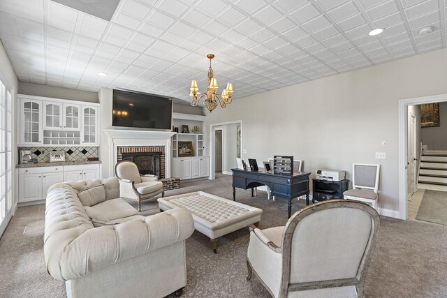 4 Colonel Winstead Dr, Brentwood, TN 37027 - living area featuring baseboards, a notable chandelier, light colored carpet, a brick fireplace, and stairs