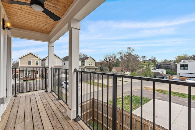 balcony featuring a ceiling fan and a residential view