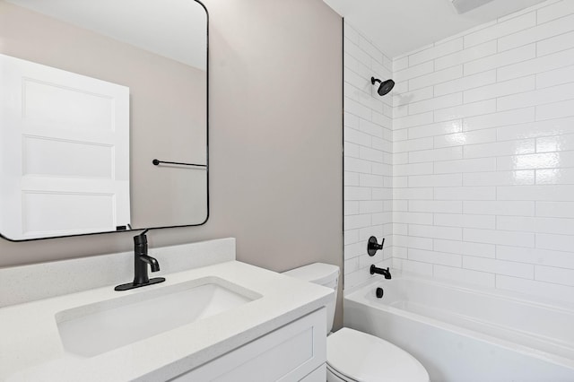 bathroom featuring toilet, vanity, and washtub / shower combination