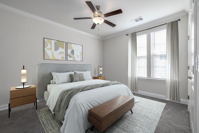 carpeted bedroom with crown molding, baseboards, ceiling fan, and visible vents