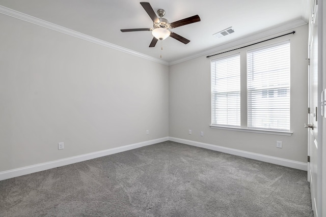 carpeted empty room with crown molding, baseboards, ceiling fan, and visible vents