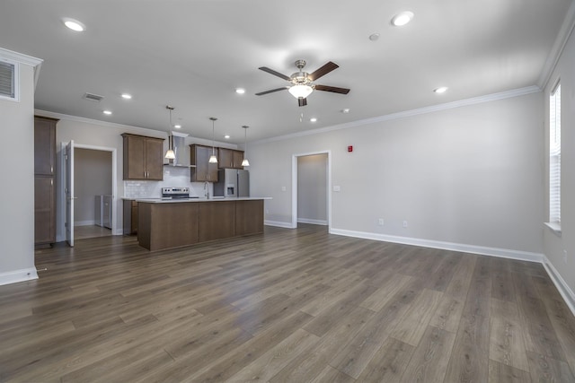 kitchen featuring visible vents, a ceiling fan, electric range oven, stainless steel refrigerator with ice dispenser, and open floor plan
