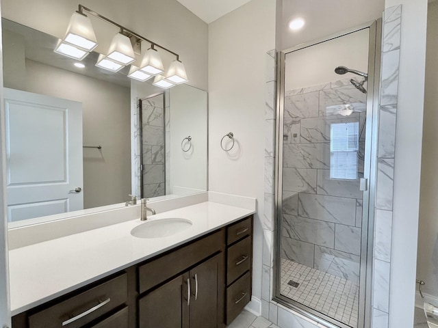 full bathroom with vanity and a stall shower