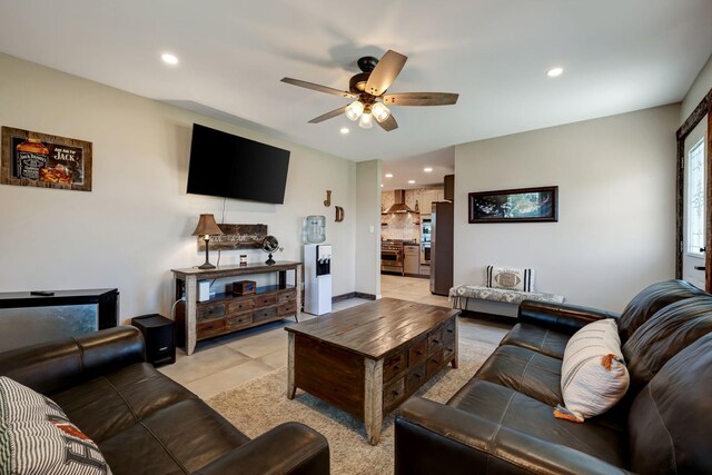 living area featuring ceiling fan, light tile patterned flooring, and recessed lighting