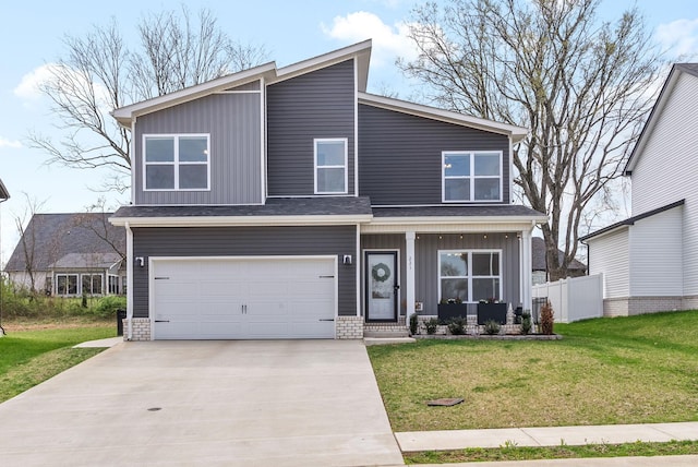 221 Wesson Dr, Clarksville, TN 37043 - view of front of house featuring concrete driveway, fence, an attached garage, board and batten siding, and a front lawn