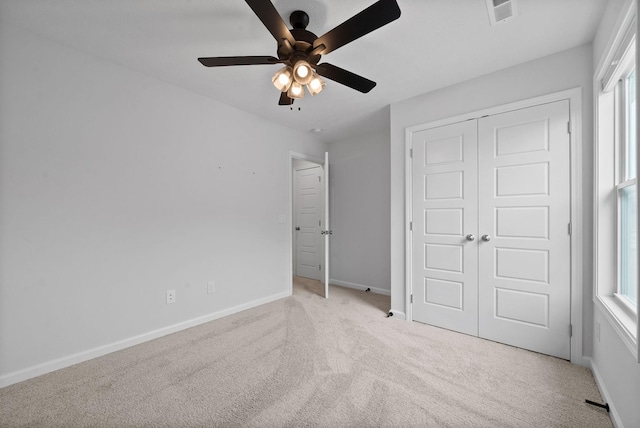 221 Wesson Dr, Clarksville, TN 37043 - unfurnished bedroom with baseboards, visible vents, a closet, and light carpet