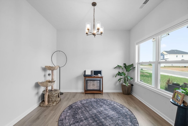 221 Wesson Dr, Clarksville, TN 37043 - sitting room featuring baseboards, visible vents, a notable chandelier, and wood finished floors