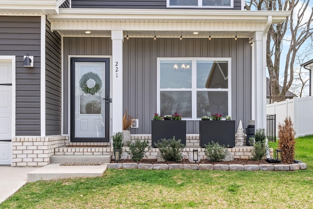 221 Wesson Dr, Clarksville, TN 37043 - doorway to property with covered porch, fence, and board and batten siding