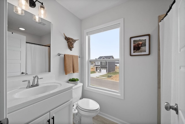 221 Wesson Dr, Clarksville, TN 37043 - bathroom featuring baseboards, visible vents, toilet, and vanity