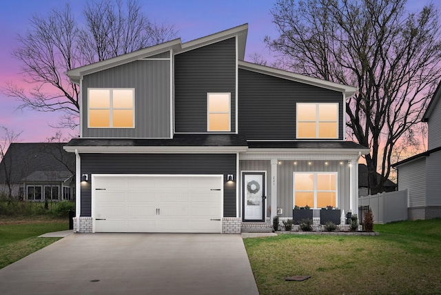 221 Wesson Dr, Clarksville, TN 37043 - view of front of house with concrete driveway, fence, an attached garage, board and batten siding, and a lawn