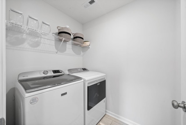 221 Wesson Dr, Clarksville, TN 37043 - laundry area featuring independent washer and dryer, baseboards, laundry area, and visible vents