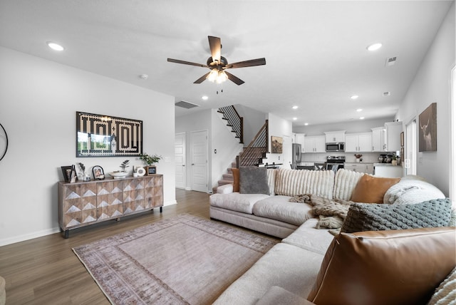221 Wesson Dr, Clarksville, TN 37043 - living area featuring visible vents, ceiling fan, wood finished floors, recessed lighting, and stairway