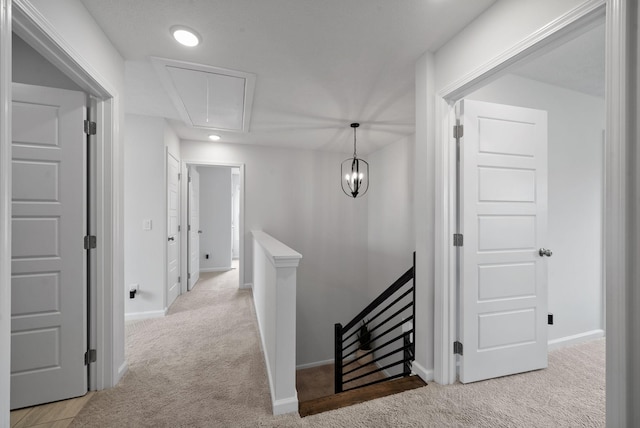 221 Wesson Dr, Clarksville, TN 37043 - hallway with an upstairs landing, carpet floors, attic access, baseboards, and recessed lighting