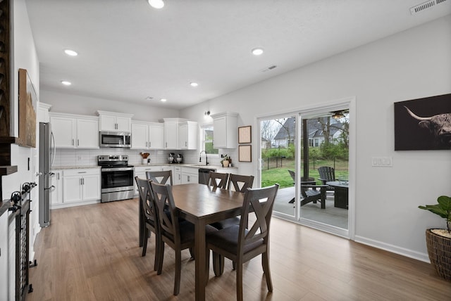 221 Wesson Dr, Clarksville, TN 37043 - dining space with visible vents, recessed lighting, and light wood-type flooring