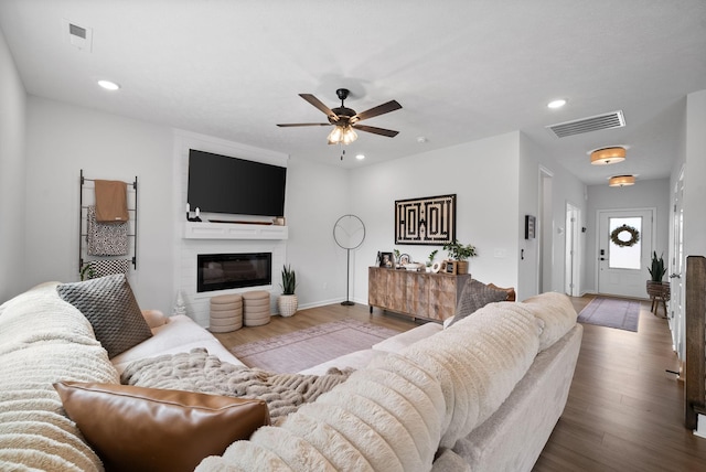 221 Wesson Dr, Clarksville, TN 37043 - living room featuring a large fireplace, wood finished floors, a ceiling fan, and visible vents