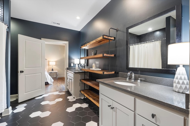 924 Gilmore Ave, Nashville, TN 37204 - full bath with vanity, connected bathroom, baseboards, and visible vents
