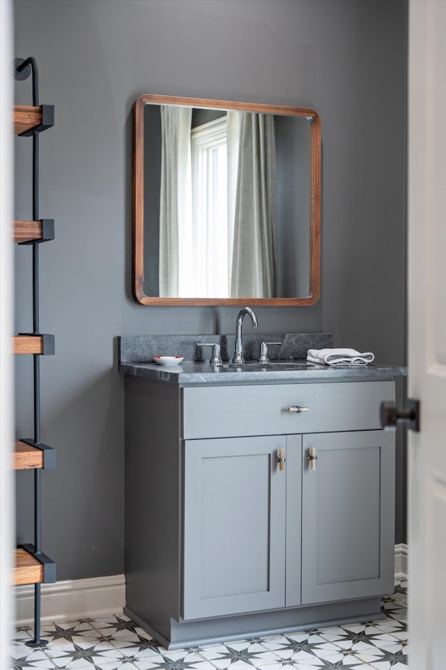 924 Gilmore Ave, Nashville, TN 37204 - bathroom with tile patterned floors, vanity, and baseboards