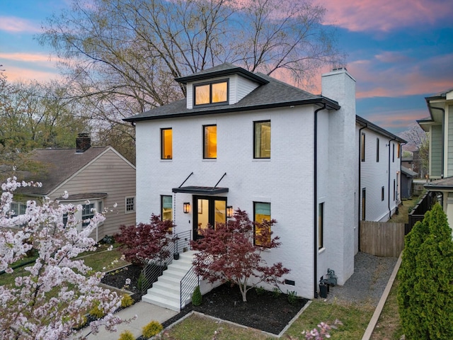 924 Gilmore Ave, Nashville, TN 37204 - back of house at dusk featuring a chimney and fence