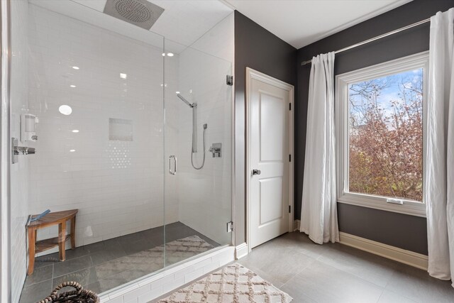 924 Gilmore Ave, Nashville, TN 37204 - bathroom with a stall shower, baseboards, tile patterned floors, and a healthy amount of sunlight