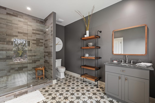 924 Gilmore Ave, Nashville, TN 37204 - full bathroom with a stall shower, baseboards, toilet, and vanity