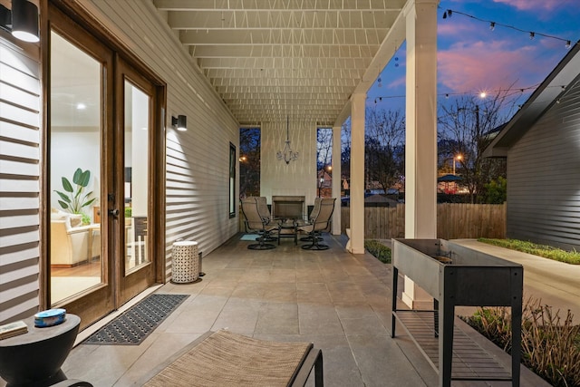 924 Gilmore Ave, Nashville, TN 37204 - patio terrace at dusk with fence and outdoor dining space