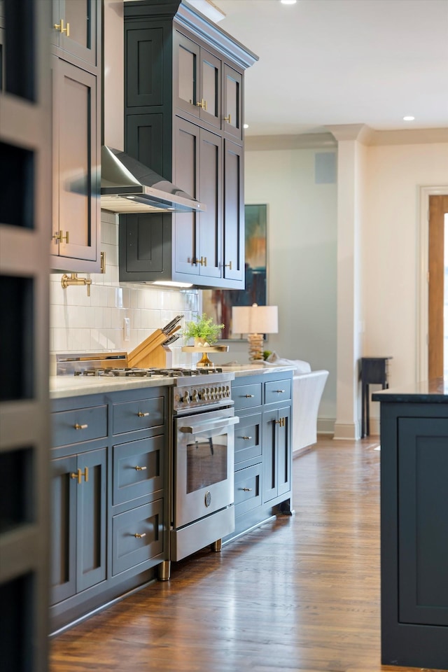 924 Gilmore Ave, Nashville, TN 37204 - kitchen with wall chimney range hood, high end stove, decorative backsplash, and dark wood-style flooring