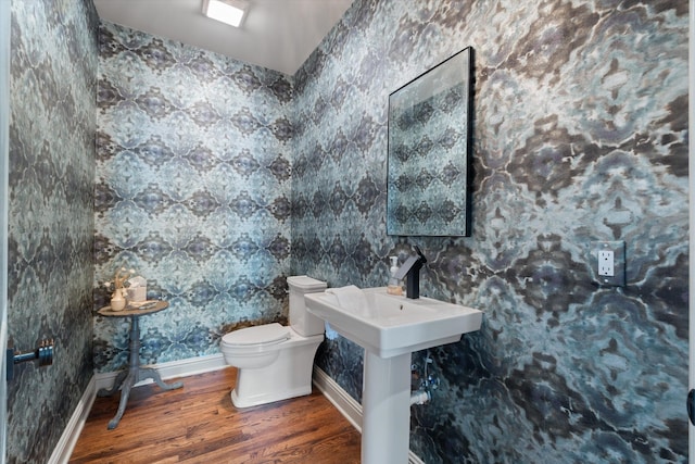 924 Gilmore Ave, Nashville, TN 37204 - half bath featuring toilet, baseboards, and wood finished floors