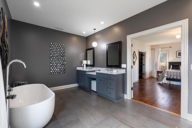 924 Gilmore Ave, Nashville, TN 37204 - ensuite bathroom with double vanity, baseboards, visible vents, a freestanding bath, and recessed lighting