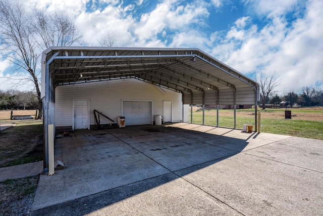 1985 Couchville Pike, Mount Juliet, TN 37122 - view of parking featuring a garage and a carport